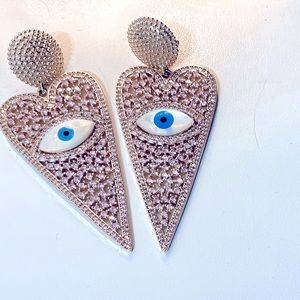 Pink rhinestone drop earrings with evil eye